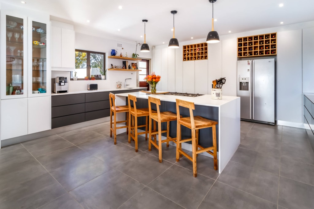 Wessels kitchen 5 Modern kitchen with central island, breakfast bar seating and built-in wine racks