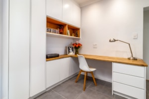 Built-in home office with desk, shelving and storage cupboards