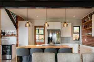 Featured_1_reduced Open-plan kitchen with breakfast counter and pendant lighting