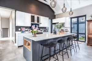 Featured_4_reduced Modern kitchen island with black bar stools and pendant lights